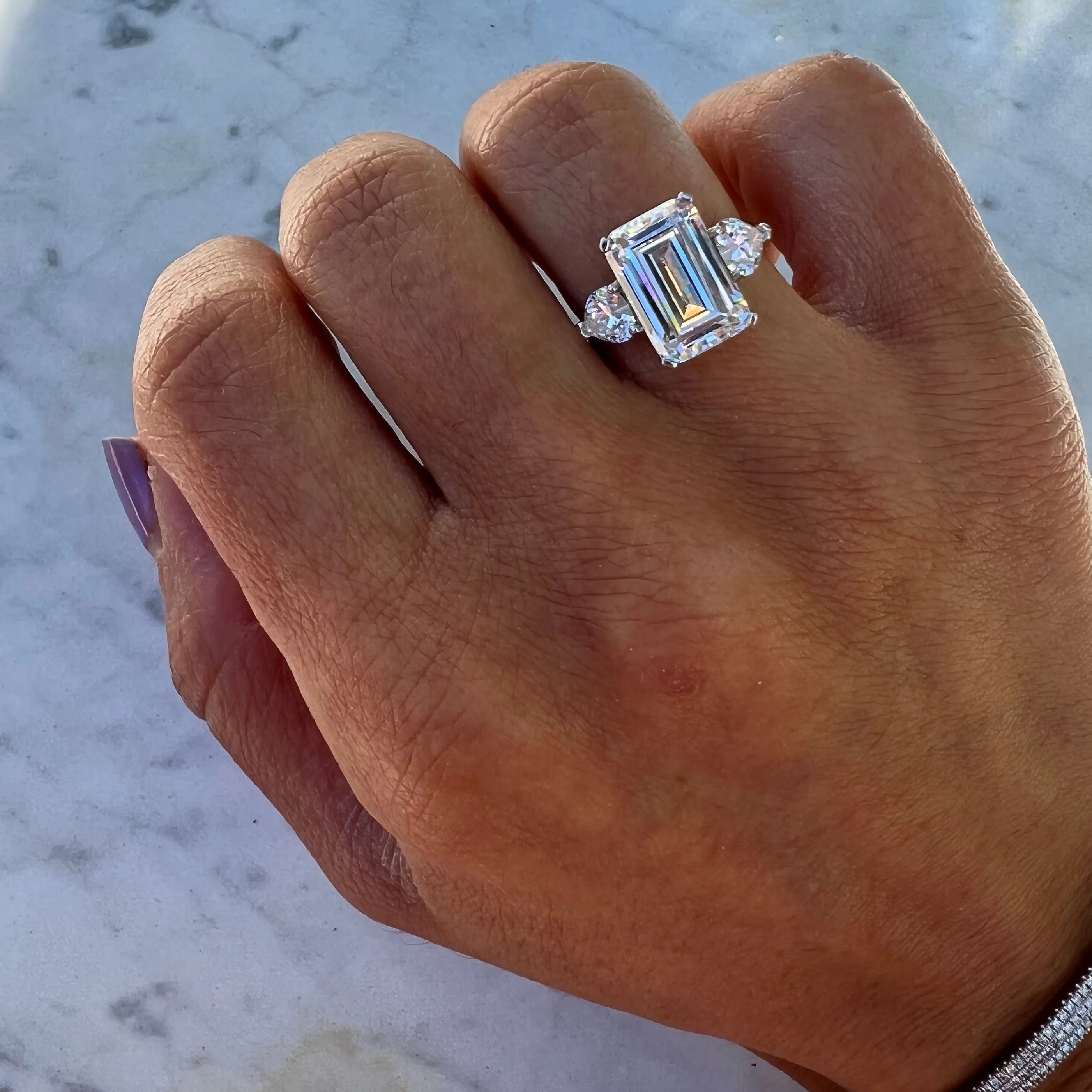 Sterling silver emerald cut cz ring with heart side stones