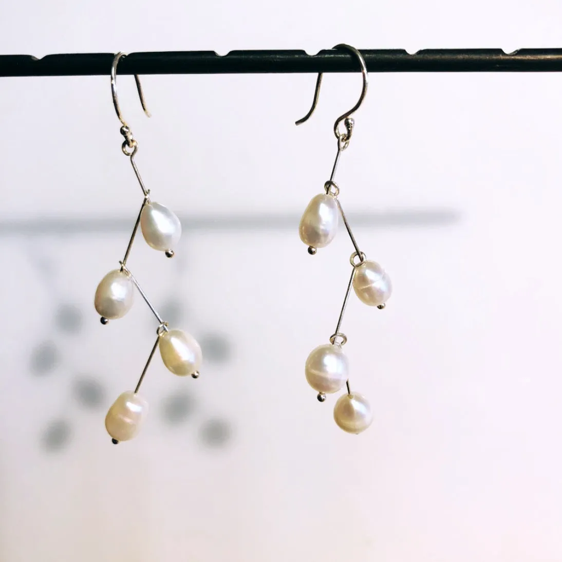 Waterfall white pearls earrings